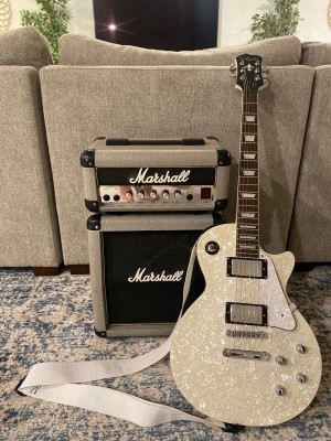 Agile AL pearl white top next to amp  From The Marshall Website.jpeg
